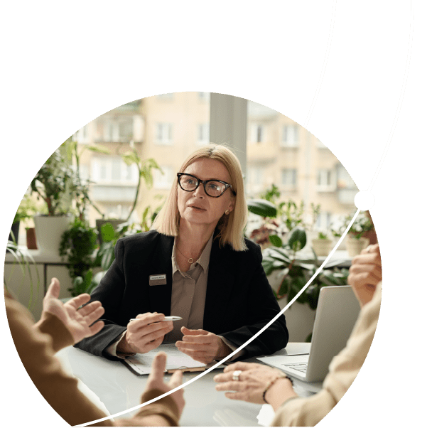 Portrait of mature woman consulting couple in insurance agency office