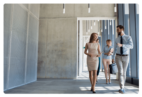 Business people walking in office corridor