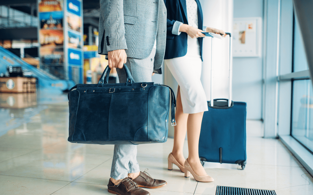 Travel Benefits Two People with Luggage